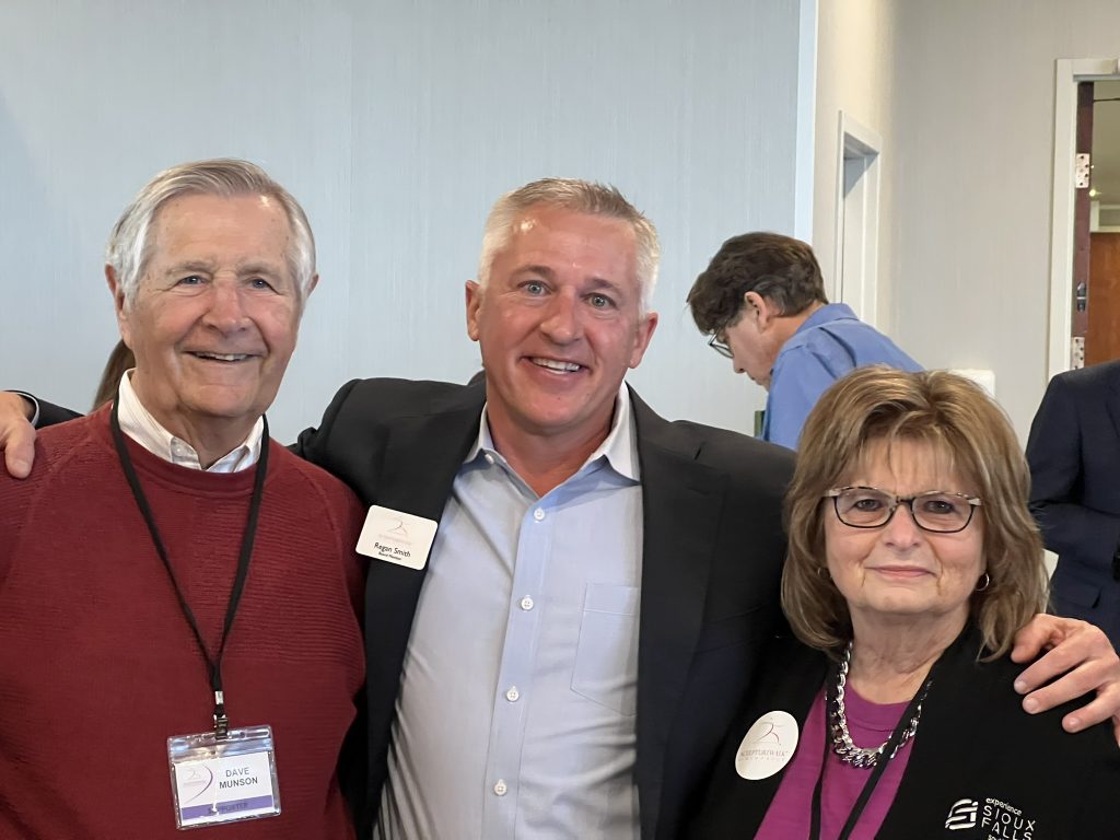 President Regan Smith (center) with former Mayor Dave Munson and Teri Schmidt
