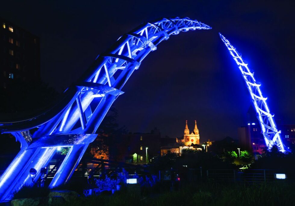arcpic The Arc of Dreams, a monumental stainless-steel sculpture spanning the Big Sioux River